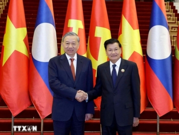 Chuyến thăm của Tổng Bí thư mở ra chương mới cho quan hệ Việt Nam - Lào