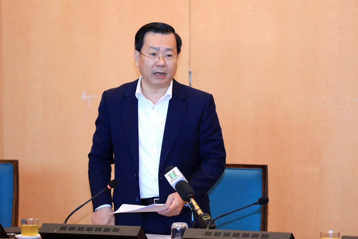 Giám đốc Sở Công Thương Hà Nội Võ Nguyên Phong báo cáo tại cuộc họp. Ảnh: Hanoi.gov.