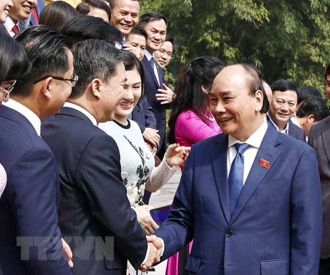 Chủ tịch nước Nguyễn Xu&acirc;n Ph&uacute;c ch&uacute;c mừng c&aacute;c đại biểu. Ảnh: TTXVN